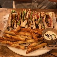Club sandwich with Cajun fries  at Mad Mad Vegan - Chueca in Madrid