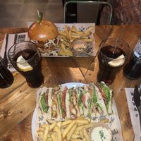 The Mad Nashville chick’n burger and The Mad Club Sandwich.  at Mad Mad Vegan - Chueca in Madrid