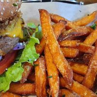 Beyond meat burger with sweet potato fries  at Mad Mad Vegan - Chueca in Madrid