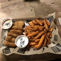 Chicken nuggets and sweet potato fries ! So good at Mad Mad Vegan - Chueca in Madrid