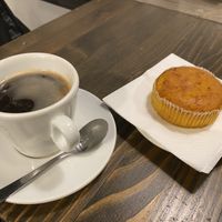 Black coffee and carrot cake  at Anhelo in Naples