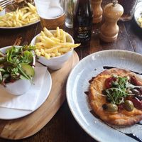 butternut squash and sweet potato humous, olives, sun-dried tomatoes, balsamic vinegar and rocket flatbread with a side salad and fries at The Celtic Arms in Mold