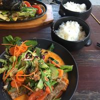Thai curry (bottom) and cha ca (top) with accompanying rice at Tiato in Berlin