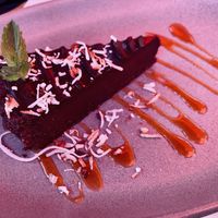 Vegan Chocolate Coconut Cake 😋   at Luna Red in San Luis Obispo