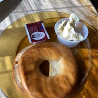 Gluten free, vegan bagel with vegan butter  at Drunken Monkey Coffee Bar in Orlando