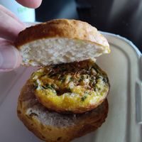 Just Egg patty made of Just Egg, vegan cheese, spinach, sauteed and onions on a biscuit at Drunken Monkey Coffee Bar in Orlando