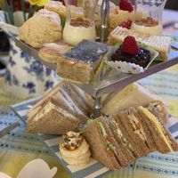 Vegan sandwich selection, vegan  vol-au-vent, vegan brownie, vegan lemon and poppy cake and vegan ginger cake  at Honeybee House Tearoom in Cardiff