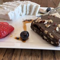 Melt in your mouth carob chocolateyyyy brownie with what tasted like caramelised pecans/walnuts inside. Perfection paired with the ice cream!!!  at Mary-Ann's Natural Emporium in Cape Town