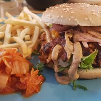 Satan burger with kimchi and fries at The Sly Fox in Edinburgh