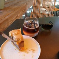 Snickers our with espresso spritzer on beautiful patio at KIRAS - Pylimo in Vilnius