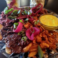 Loaded fries with four "meats" and cheese sauce at Byczyn in Poznan