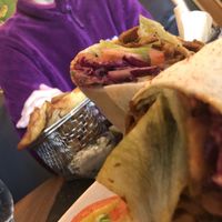 Seitan wrap with chips & tofish in the background  at Wine & Reason in Worthing