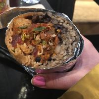 Burrito in wholemeal tortilla, sobroso (marinated soya chunks), brown rice, pico de gallo, black beans, hot salsa. Just half of it is displayed on the photo at Tolteca in Dublin