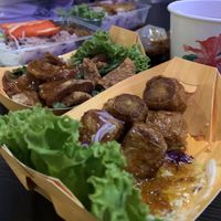 Deep fried skin tofu rolls, garlic tempeh, barbecued red porkless with rice, grilled chicken dip, complimentary soup at So Vegan - Gateway Ekkamai in Bangkok