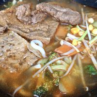 Würzige Brühe mit Seitan, Tofu und Udon   at Slurp Nudelbar in Munich