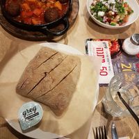 Vegan Shakshuka with falafel, bread and Israeli salad at Greg Cafe in Haifa
