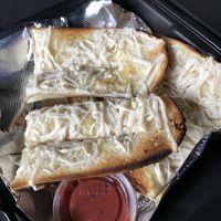 Vegan cheesy bread! You can tell it’s vegan cuz the cheese doesn’t really melt 🤪  at The Parlor in Austin