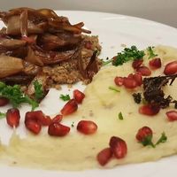 Raw walnut and caramelized shallots tart with parsnip purée.  at Le Poisson Sans Bicyclette in Brussels