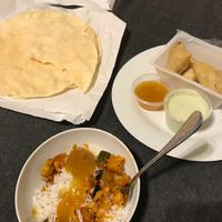 Vegetable curry, vegetable samosas, mango chutney and papadums  at Holy Cow in South West London