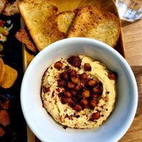 Houmous with crispy chilli chickpeas and olive oil baked sourdough. at Dauns in East London