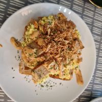 Tofu scramble with sausage, crispy onion & harrisa mayo at Dauns in East London