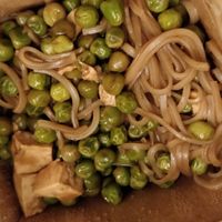 Rice noodles in teriyaki sauce with tofu and peas at Noobox in Montreal
