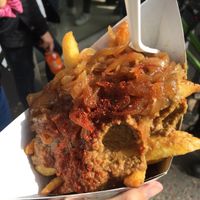 Fries with caramelized onions, olive tapenade and merkén.  at Papachecos in Santiago