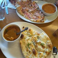 Pan naam de ajo y otro con castañas y creo que cebolla at Raja in Naha