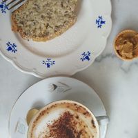 Oat milk cappuccino and banana bread with peanut butter at L'Alchimiste in Brussels