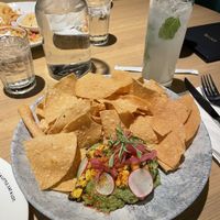 Avocado street corn appetizer. Pretty alright but really just guac with corn in it.  at Earls in Plano