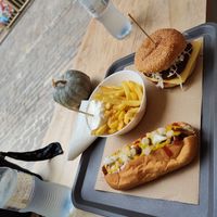 Hot dog and burger menu with fries and water at Mel Vegan Fast Food in Tenerife