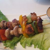 New vegan chicken satay skewers with peanut sauce at Ananda Fuara in San Francisco