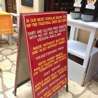 A-board outside her small bakery/cafe.  at Rose's Bakery in Corfu