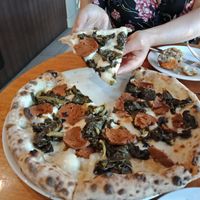 Veganised 'Salsicce e Friarelli' pizza with a half eaten arancini ball in the background because I couldn't wait ;-) at Il Caminetto in Moonee Ponds