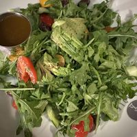 Salad with olive, tomatoes, arugula and avocado   at Piola in Miami Beach