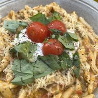 Home-made cheese with cherry tomatoes, pasta with tomato pesto  at Spritz in Antwerpen