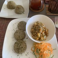 Coconut chickpeas, sweet potato mash, Callaloo dumplings, watermelon juice  at Living Food and Juices in Kingston
