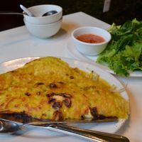  Banh Xeo vietnamese pie filled with mushrooms, tofu, mock meat, soy sprouts. Served with lettuce, fresh herbs and sauce at Golden Era Vegan Restaurant in San Francisco