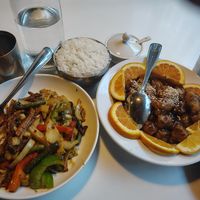 Mushroom curry stir fry and sweet orange with a side of white rice  at Golden Era Vegan Restaurant in San Francisco
