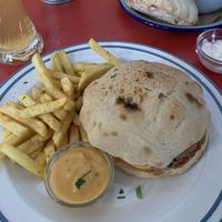 Notcheese burger and goulash in the background  at Szabad Bisztro in Budapest