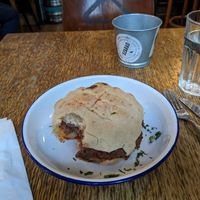 I promise that the Balkan Burger did not have a bite taken before it was served to me. at Szabad Bisztro in Budapest