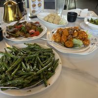 Green beans, sesame balls, honey walnut chicken (not sure if vegan), edamame, pepper steak  at Rui's Shanghai Bistro in Redlands