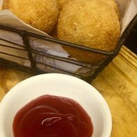 Croquetas: smash potatoes, olives and cheese at Liberty Bar in Montevideo