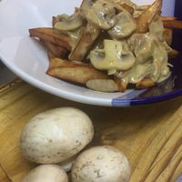 Homemade fries with mashrooms sauce at Liberty Bar in Montevideo