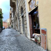 outside at Mizio's in Rome