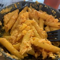 Vegan Mac and cheese with a few bites taken out at World Famous House of Mac in Miami
