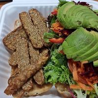Temptress burger with satay tempeh and loads of fresh salad at The Lillipad Cafe in Cairns