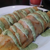 Vegan Mediterranean crepes, rainbow juice in background - yummy at The Lillipad Cafe in Cairns