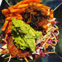 Delicious! Beyond meat burger, sweet potato fries, guacamole, coleslaw, and vegan bacon jam!  at The Brine Well Eatery in Syracuse