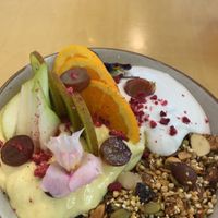 Mango granola with fruit and coconut yoghurt  at Gratitude in Tauranga